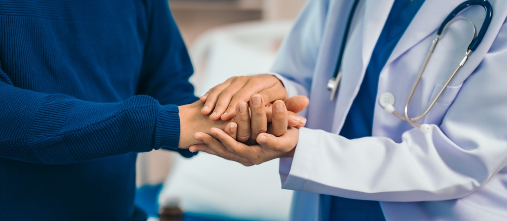 Doctor carefully reviewing MRI results with focused patient